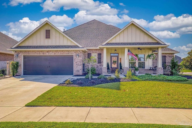 craftsman-style home with a front yard, a garage, and a porch