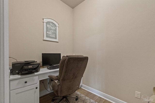 office with light wood-type flooring