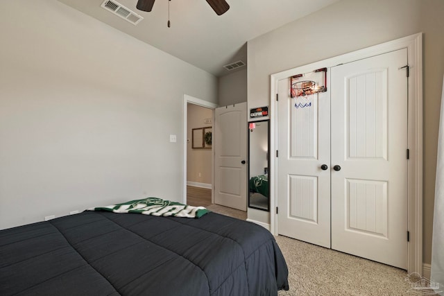 bedroom with light carpet, a closet, and ceiling fan