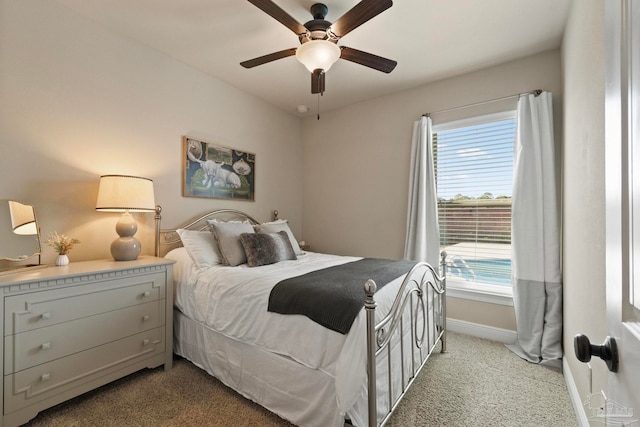 bedroom with ceiling fan and light colored carpet