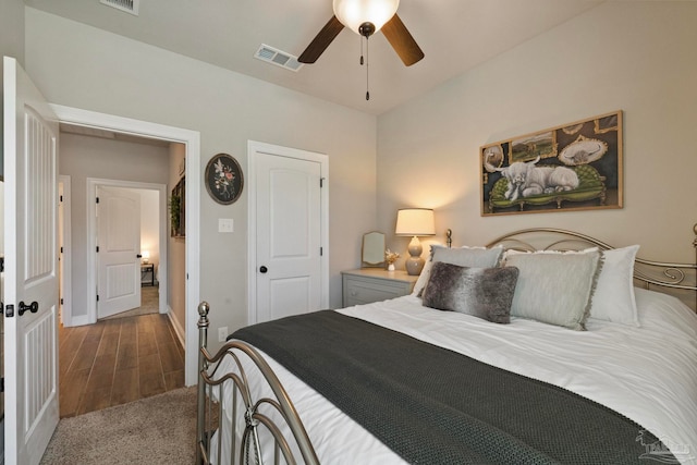 carpeted bedroom with a closet and ceiling fan