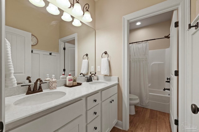 full bathroom featuring vanity, toilet, shower / bath combination with curtain, and wood-type flooring