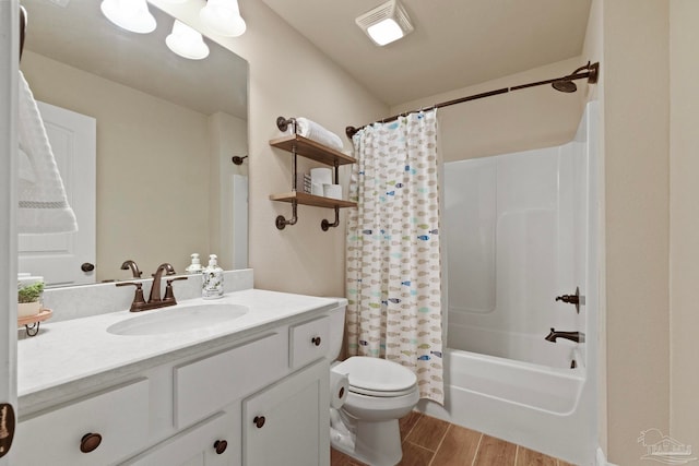 full bathroom featuring vanity, toilet, wood-type flooring, and shower / bath combo