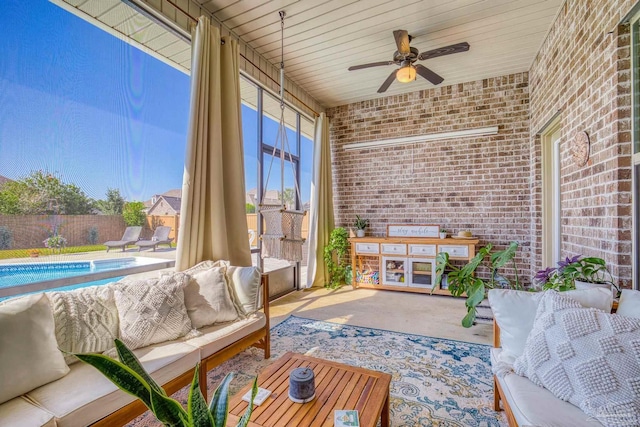 sunroom / solarium with wood ceiling and ceiling fan