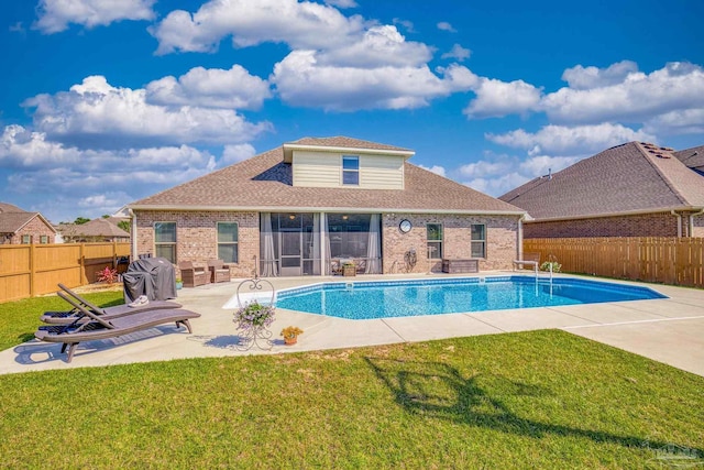 view of pool featuring a patio area and a lawn