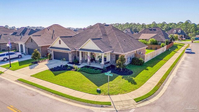 view of front facade with a front yard and a garage