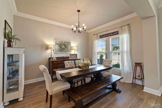 dining area with crown molding, a notable chandelier, and dark hardwood / wood-style floors