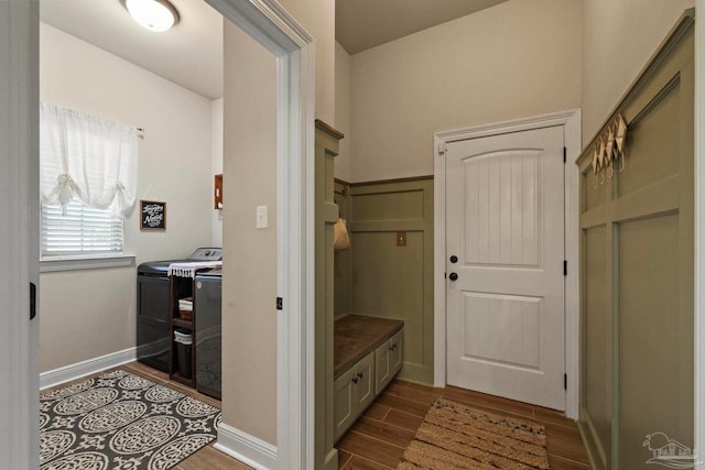 mudroom featuring washer and dryer and hardwood / wood-style flooring