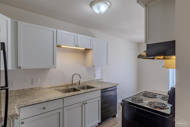 kitchen featuring black appliances, light wood-style flooring, a sink, tasteful backsplash, and ventilation hood