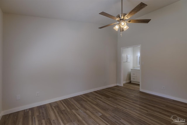 spare room with a ceiling fan, baseboards, and wood finished floors