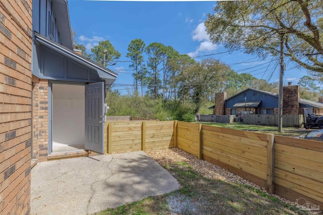 view of yard featuring a patio and a fenced backyard