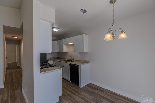 kitchen with visible vents, dark wood-type flooring, black dishwasher, white cabinetry, and a sink