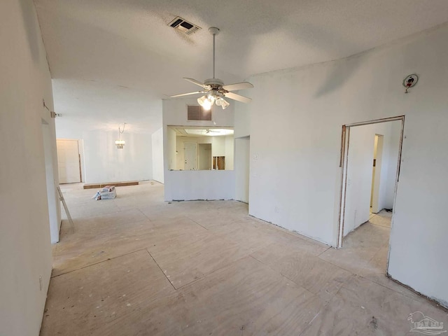 unfurnished living room with ceiling fan and visible vents