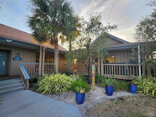 view of property exterior featuring a wooden deck