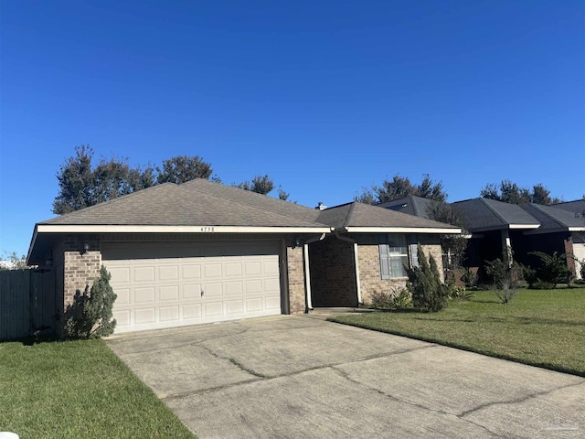 ranch-style house with a garage and a front yard