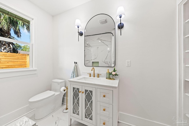 bathroom featuring visible vents, baseboards, toilet, marble finish floor, and vanity