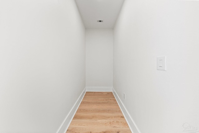 interior space with visible vents, baseboards, and light wood finished floors