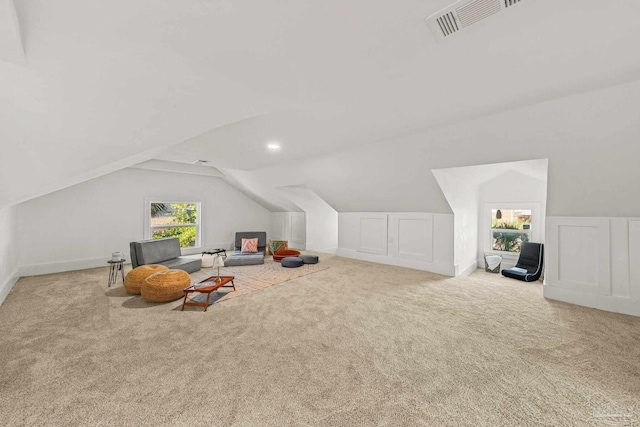 additional living space with recessed lighting, visible vents, carpet, and vaulted ceiling