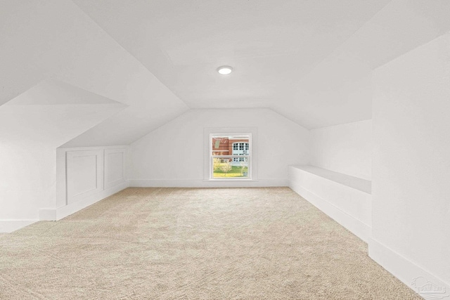 bonus room featuring carpet and lofted ceiling