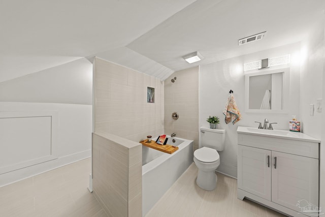 full bathroom featuring visible vents, toilet, bathtub / shower combination, vanity, and vaulted ceiling