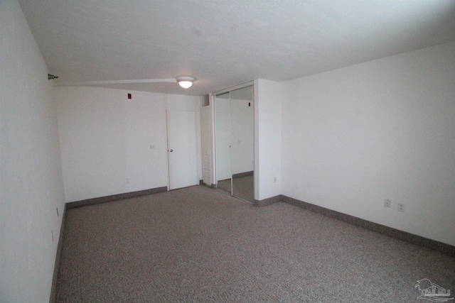 unfurnished room with carpet floors