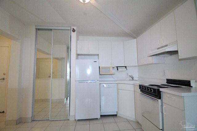 kitchen with sink, white cabinetry, white appliances, and light tile patterned floors