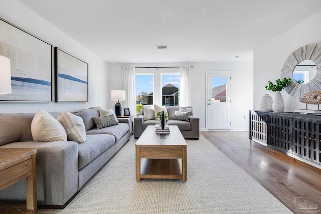 living room with wood finished floors and baseboards