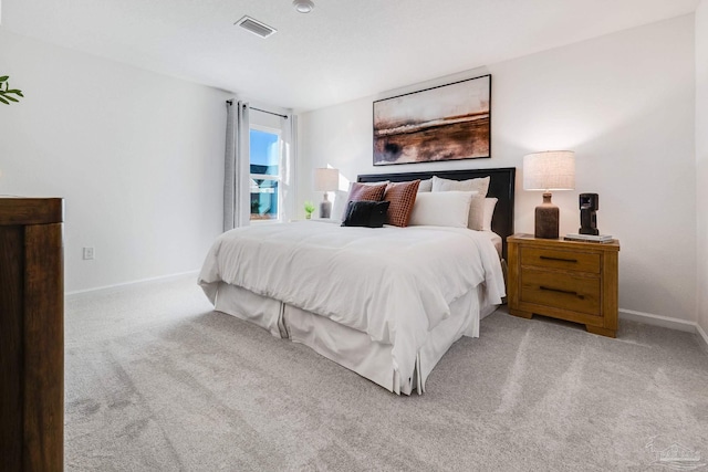 carpeted bedroom with baseboards