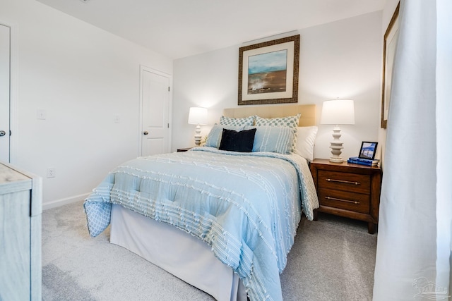 carpeted bedroom featuring baseboards