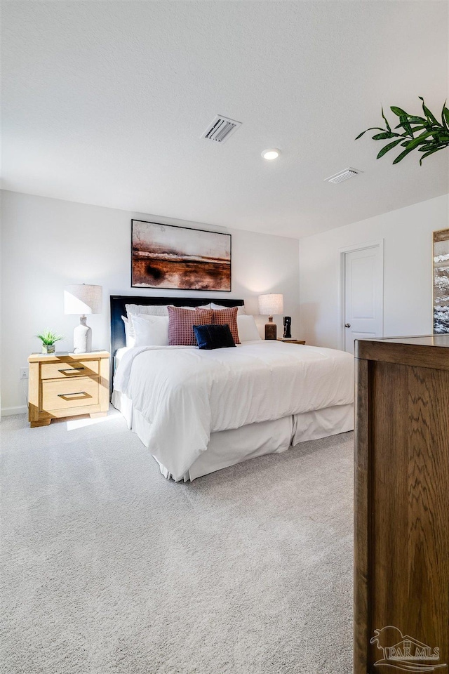 bedroom with carpet flooring and recessed lighting