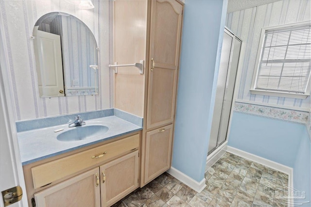 bathroom with vanity and walk in shower