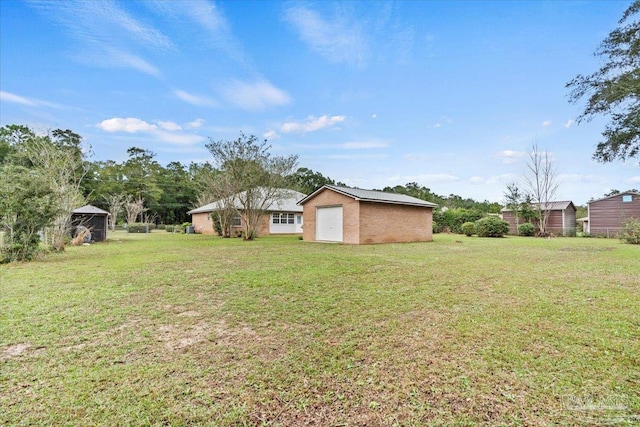 view of yard with a garage