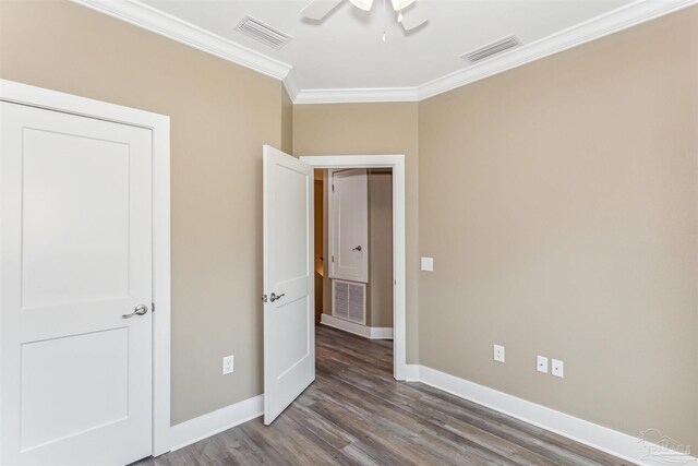 unfurnished bedroom featuring light hardwood / wood-style floors, crown molding, and ceiling fan