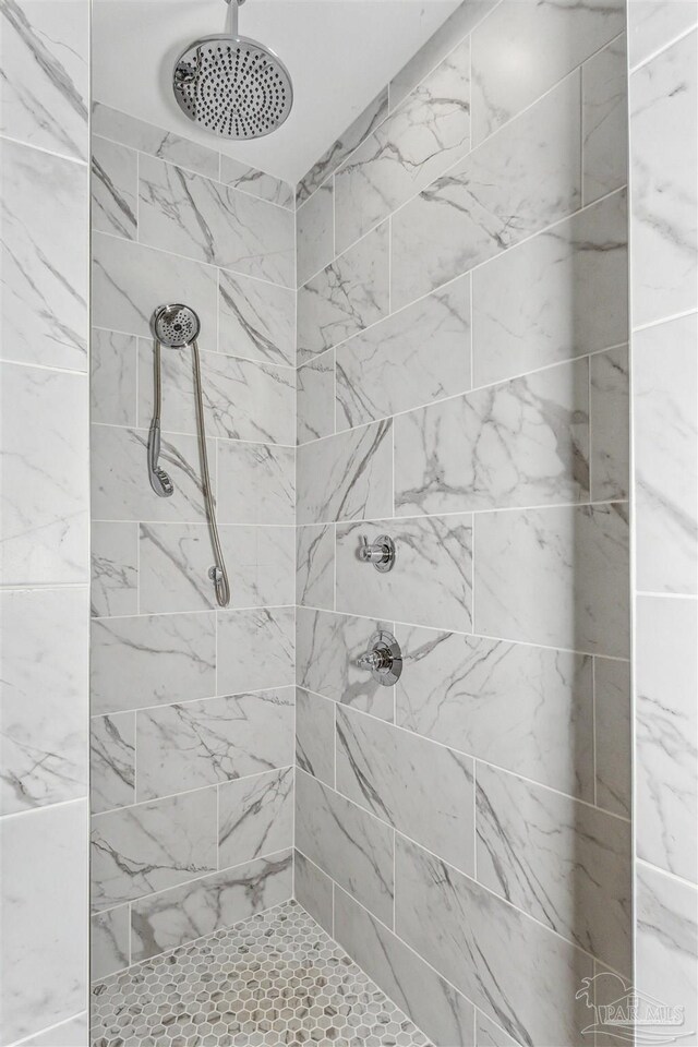 bathroom with tiled shower