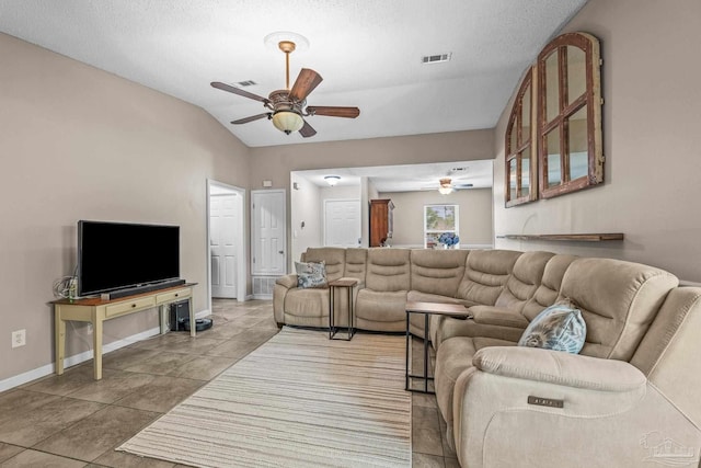 tiled living room featuring vaulted ceiling and ceiling fan