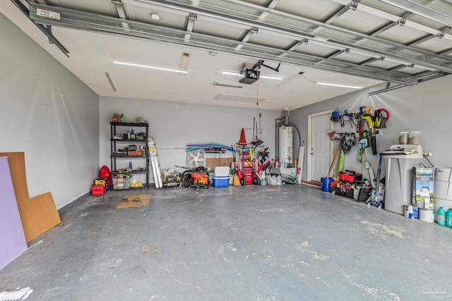 garage with a garage door opener and water heater