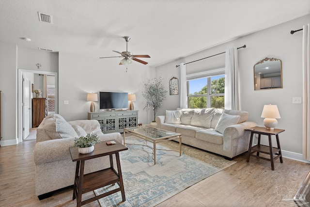 6347 Ladera Trl, Pace, FL 32571 - living area with ceiling fan, wood finished floors, and baseboards
