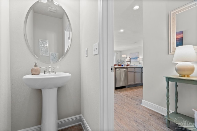 6347 Ladera Trl, Pace, FL 32571 - bathroom featuring wood finished floors, baseboards, and recessed lighting
