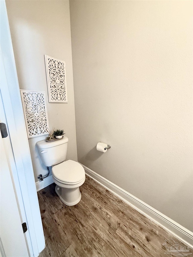 6347 Ladera Trl, Pace, FL 32571 - bathroom featuring toilet, wood finished floors, and baseboards