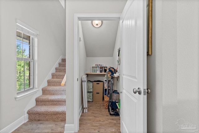 6347 Ladera Trl, Pace, FL 32571 - stairway with healthy amount of natural light, wood finished floors, baseboards, and lofted ceiling