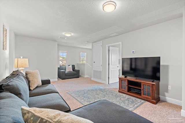 6347 Ladera Trl, Pace, FL 32571 - carpeted living room featuring baseboards and a textured ceiling