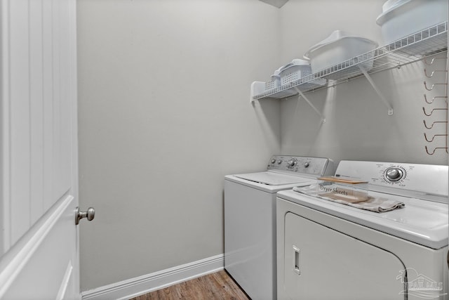 6347 Ladera Trl, Pace, FL 32571 - laundry area featuring separate washer and dryer, baseboards, and wood finished floors
