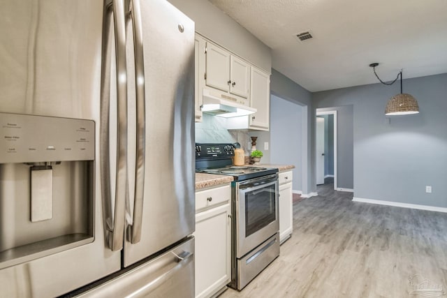 kitchen featuring white cabinets, decorative light fixtures, light hardwood / wood-style floors, and stainless steel appliances