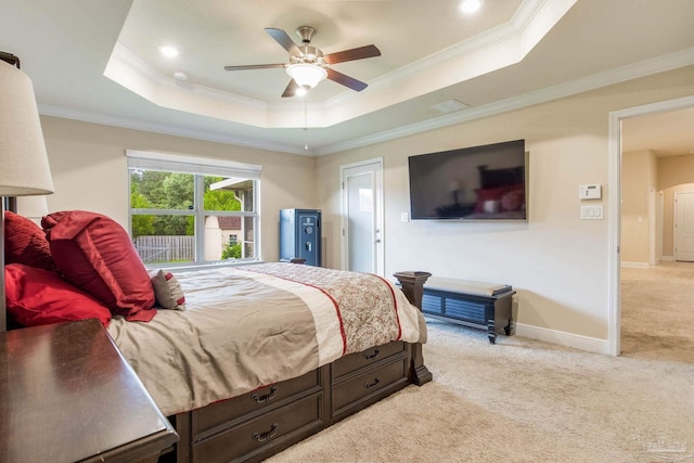 bedroom featuring light carpet, ornamental molding, and ceiling fan