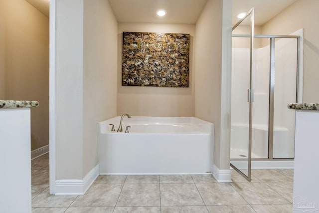 bathroom featuring separate shower and tub and tile patterned flooring