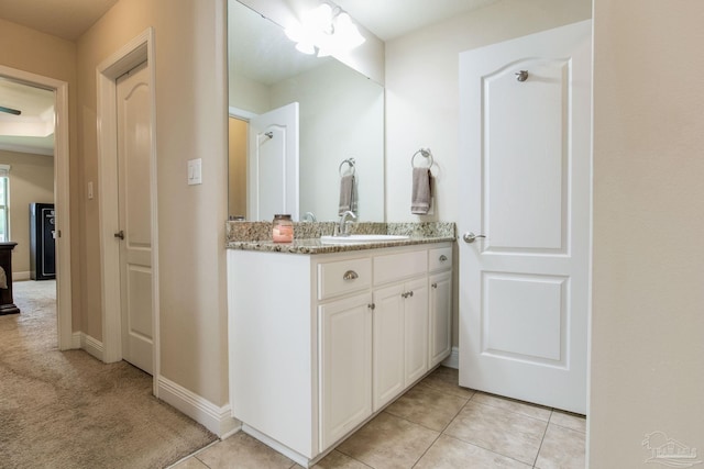 bathroom with tile patterned floors and vanity