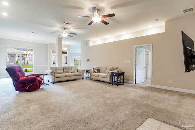 living room featuring ceiling fan and light colored carpet