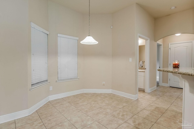 spare room with light tile patterned floors