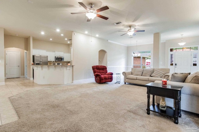 tiled living room featuring ceiling fan