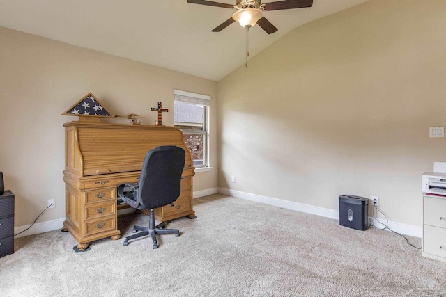 carpeted office space featuring vaulted ceiling and ceiling fan